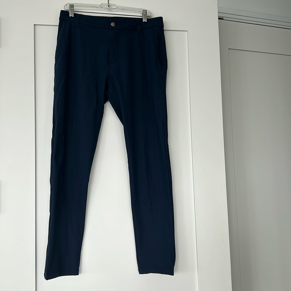 Lululemon men’s navy performance fabric trousers. 32” waist